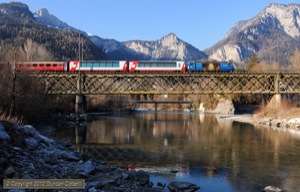 652 led RE1152 across the Hinterrhein at Reichenau-Tamins on 9 March 2012. Between the railway bridge and the road bridge in the background, the Hinterrhein joins with the Vorderrhein to form the River Rhein. 