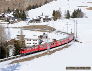 610 spent most of 10 March 2012 shuttling back and forth between Bergün and Preda with Schlittelzüge, trains for sledgers. It was photographed climbing from Bergün on train 865.
