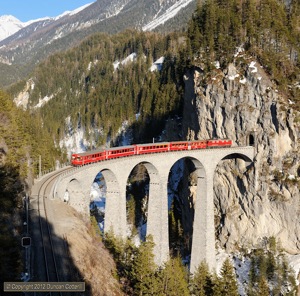 Possibly the very last passenger train diagrammed to be worked by a Ge4/4i? 610 propelled 873 over the Landwasser viaduct on its way back from Bergün to Chur on the afternoon of 10 March 2012.