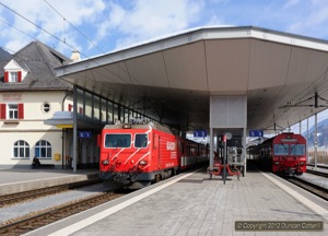 MGB HGe4/4ii 106 left Disentis with train 839, the 13:14 to Andermatt, on 11 March 2012. On the right is RhB driving trailer 1752, unusually employed on Scuol-Tarasp to Disentis trains.
