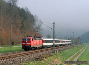 Class 181 locos are booked to work a number of services on the Stuttgart - Singen line on Fridays and Saturdays. 181.212 was hauling IC181 (appropriately), the 05:56 Frankfurt - Zürich, south past Grünholz, north of Oberndorf, as the fog lifted on 13 April.