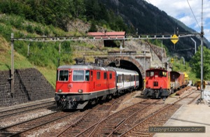 The Gotthard was a good place to photograph Re4/4iis on passenger trains. 11215 was leaving the Mittlere Entschigtal Galerie and entering Wassen station with IR2280, the 10:45 from Locarno to Zürich HB, on 29 August 2012. On the right is a class 232 diesel but not the sort most of us are used to!