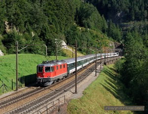 High above the village of Wassen, 11151 led IR2163, the 08:20 Luzern - Locarno passenger, away from the Maienkreuz Tunnel on 2 September 2012.