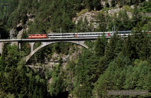 Both the remaining Swiss Express liveried Re4/4iis were seen on the Gotthard during my stay but this was the only photo I got in sun. 11108 crossed the Mittlere Meienreussbrücke with IR2178, the 11:45 Locarno - Basel SBB, on 2 September 2012. The photo was taken from St.Gallus Church at Wassen. A gallous spot indeed!