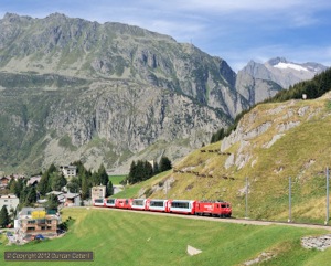 HGe4/4ii 106 worked train 906, the third section of the eastbound Glacier Express, up the rack out of Andermatt on 3 September 2012.
