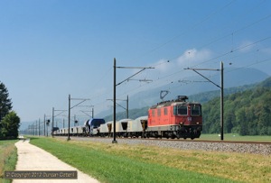 11285 trundled east with a ballast train near Oberbuchsiten on 7 September 2012.