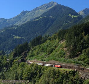 460.077 descended the north ramp of the Gotthard with IR2178, the 11:45 Locarno  - Basel SBB passenger, on 8 September 2012. The train was photographed exiting the Intschi tunnel between Zgraggen and Amsteg-Silenen.