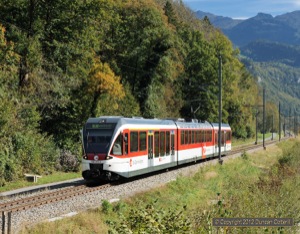 The arrival of a batch of class 130 EMUs in 2004 should have meant the end for the class 110s. 130.010 worked train 7448, the 12:46 Meiringen - Interlaken Ost, westwards near the site of the closed Unterbach halt on 6 October 2012.