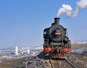 High above Wulong Mine, SY.1397 waited while the contents of it's train were dumped. 