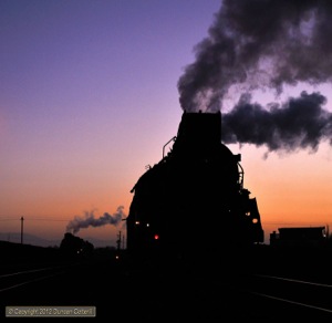 One thing I've learned at Sandaoling is that every dawn is different with colours and cloud effects varying tremendously from day to day. On 18 November, a purple and orange day, JS.8225 waited to leave Dongbolizhan with the workers' train to Xibolizhan. In the distance, JS.8040 waited for a fresh crew.