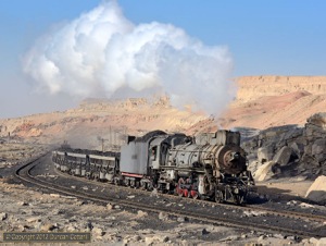 After its trip to Xibolizhan on the passenger, JS.8225 resumed its duties on coal trains between the opencast loader and Xuanmeichang. The loco was photographed hustling a loaded train through the painted desert, east of the loader, on 18 November.