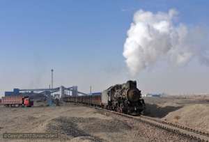 JS.8358 had to wait for the road at Erjing, allowing us to get ahead for a second shot of the train leaving the yard there. Like at Yijing, the first section out of the mine is uphill but then it's downhill all the way to Nanzhan. 