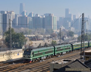 The DF10F is a class that never got beyond the prototype stage in China, although it has been built for export. Each unit is powered by a 12-cylinder version of the engine used in the DF4D giving a total power output of almost 6000HP. DF10F.2003 pushed a train of empty stock back to the carriage sidings near to Beijing station on 24 November. The loco is thought to have worked in with train 6452, the 06;45 stopper from Tianjin. 